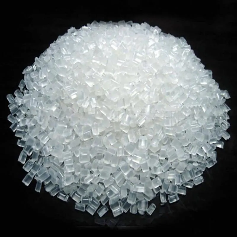 Heap of clear polypropylene granules on a black background