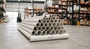 Stacked PVC pipes in a warehouse